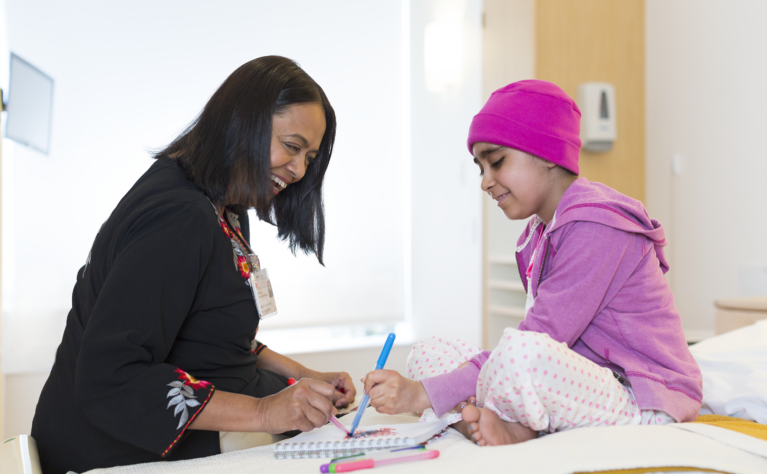 A young cancer patient making art