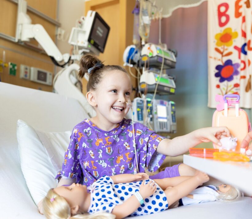 Smiling patient in hospital bed