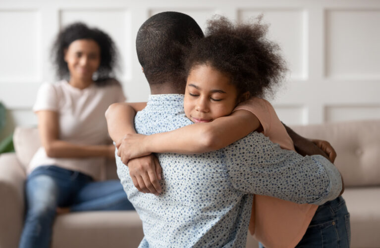 Father hugging his daughter
