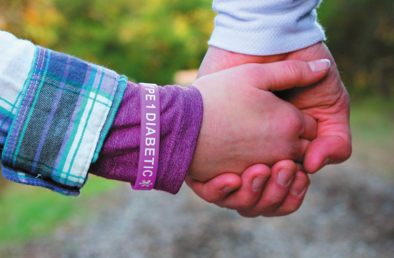 Hand with diabetes bracelet